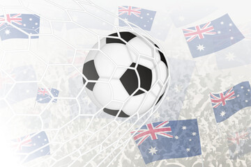 National Football team of Australia scored goal. Ball in goal net, while football supporters are waving the Australia flag in the background.