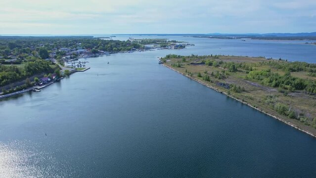 Aerial view of Little Current town and bay near swing bridge at calm summer day with blue sky, Northeastern Manitoulin and the Islands. Ontario, Canada. Direction to Goat Island and Maltas.