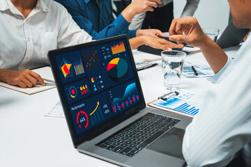 Analyst team uses BI Fintech display laptop to analyze financial data . Business people analyze BI...