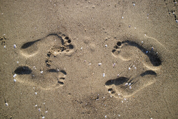 Fototapeta na wymiar Photographic documentation human footprints in the sand