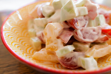 Tomato and cucumber salad in sour cream