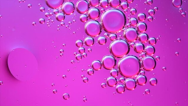 Abstract bubbles floating background. Liquid purple abstract backdrop. Flowing colorful abstract rounds. Beautiful violet floating texture. Liquid Art Wallpaper. Flowing Surface, slow motion