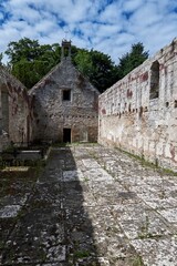 Church of the Blessed Peter in Duffus, Scotland on a sunny day against the bright blue sky