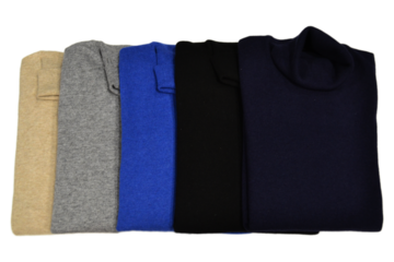folded wool and cashmere turtleneck sweaters on  a white  background  