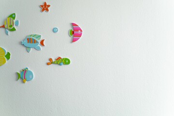 Close-up of a wall with colorful fish art