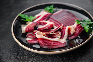 duck meat dried breast magret smoked jerky cured dried fresh eating appetizer meal food snack on the table copy space food background rustic top view