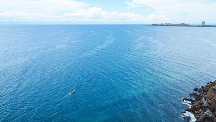 Photos from a drone of the Moreno Beach Margarita island and the angel rock momument.  Beach Landscape scenery and construction of houses in process