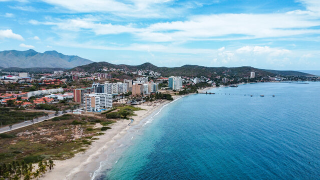 Photos from a drone of the Moreno Beach Margarita island and the angel rock momument.  Beach Landscape scenery and construction of houses in process