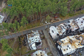 Hostomel, Kyev region Ukraine - 09.04.2022: Top view of the destroyed and burnt houses. Houses were destroyed by rockets or mines from Russian soldiers. Cities of Ukraine after the Russian occupation. - 672402329