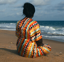 African woman looking at the sea