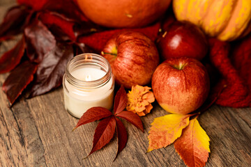 Meditation with candles, relaxation. Autumn arrangement of apples on the table