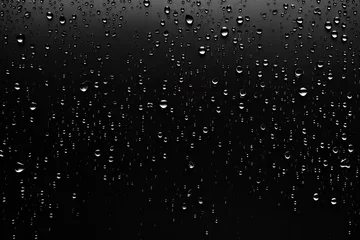 Fotobehang Rain, Water drops on the matte black glass backdrop © valentina