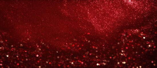 An abstract background with a Christmas theme featuring a textured appearance reminiscent of red glitter - obrazy, fototapety, plakaty