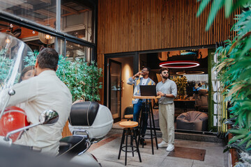 Multiracial colleagues in a modern office brainstorm creative ideas, discuss growth and profit, and demonstrate teamwork. International, diverse, and innovative professionals collaborate for success.