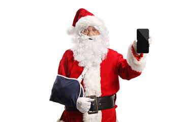 Santa Claus with an arm injury wearing a sling and holding smartphone