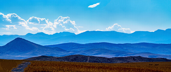 Panorama view of mountains, morning, blue light, clouds