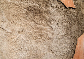 The texture of the stone is beige.Decorative stone or concrete. Rough texture.