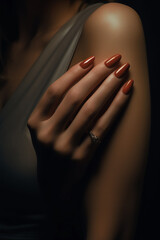 Close-up of female hands with red nail polish. Dark mood picture.