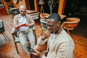 Multicultural Business Executives Planning Profitable Cafe Expansion in Urban City