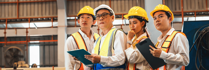 Group of engineer with factory foreman or supervisor oversee training program or conduct safety...