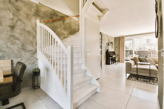 House with white staircase and living room