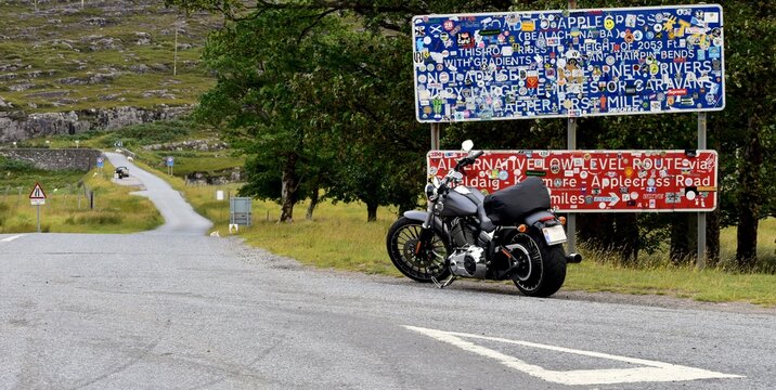 Harley Davidson parked in front of Applecross pass in Scotland, August 2020