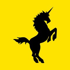 Illustration of a majestic unicorn silhouette set against a vibrant yellow background