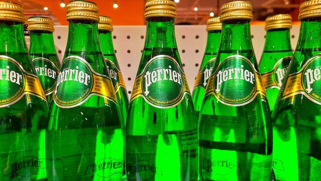 Balikpapan, 1 October 23. Close-up Of A Green Perrier Can Filled With Carbonated Water. Bottle Of Perrier Sparkling Natural Mineral Water.