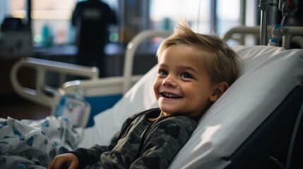 Cute child in hospital bed and smiling. Portrait of a little boy in hospital lying in a bed in positive mood.. Happy smiling little boy lying in bed at hospital and looking away.