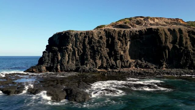 Drone footage of the sea cliff and Pulpit Rock (Cape Schanck) in Victoria, Australia