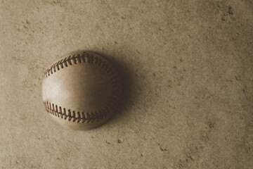 Fototapeta na wymiar Baseball ball with vintage style texture background with copy space.