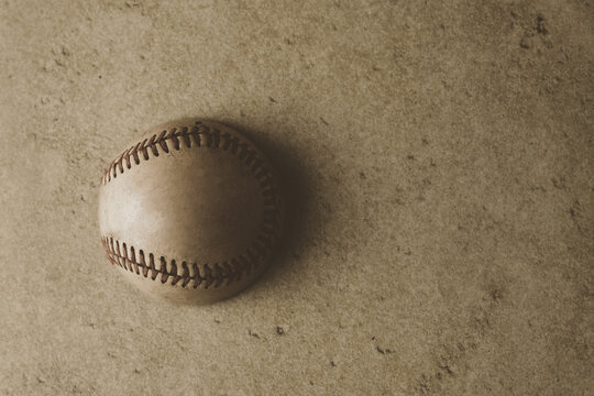 Baseball ball with vintage style texture background with copy space.