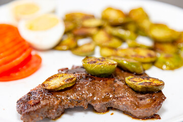 The most traditional grilled beef liver with jiló. Brazilian rustic food