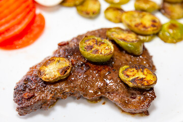 The most traditional grilled beef liver with jiló. Brazilian rustic food