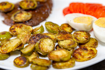 The most traditional grilled beef liver with jiló. Brazilian rustic food