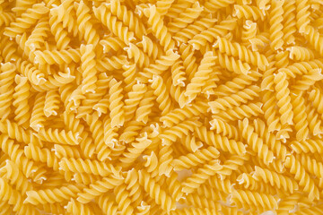 Dry pasta closeup uncooked on background