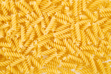 Dry pasta closeup uncooked on background