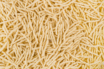 Dry pasta closeup uncooked on background