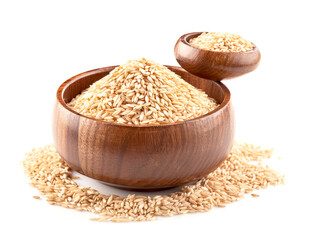 Pile of brown rice in wooden bowl isolated on white background.