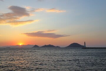 Naklejka premium sunset on the beach. Seaside town of Turgutreis and spectacular sunsets. Selective Focus.