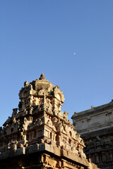Fototapeta premium Temple tower with Moon in the blue sky background.