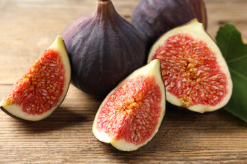 Fresh ripe figs on wooden table, closeup