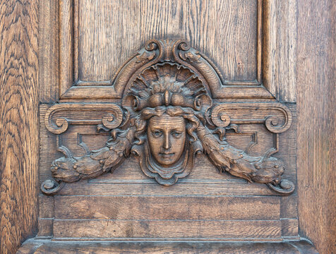 Wooden carving of a woman's head with intricate details, part of the side entrance of Royal Swedish Opera House, Swedish: Kungliga Operan, located in the borough of Norrmalm, Stockholm, Sweden