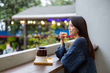 Woman drink of tea at coffee shop