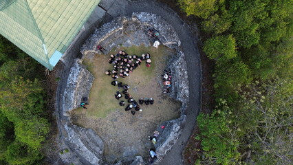 aerial view of students visiting Otanaha Fortress, Gorontalo-Indonesia. Otanaha Fortress