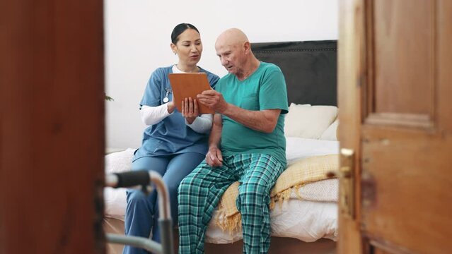 Tablet, nurse and senior man in bedroom, talking and consultation in nursing home. Tech, elderly person with a disability on bed and caregiver in conversation, help and healthcare results or report