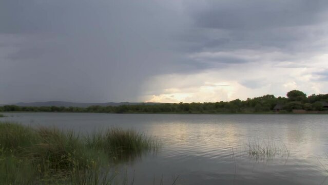 Gaborone dam in Botswana, lake at sunset, hills in the background