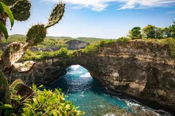 Raamstickers The spectacular phenomenon of a natural bridge between the bay and the ocean at Broken beach on the island of Nusa Penida near Bali, Indonesia © Milan