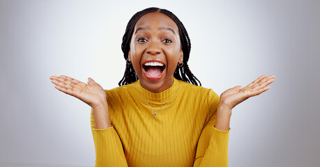 Wow, portrait and excited black woman in studio happy with competition news, prize or bonus on grey...