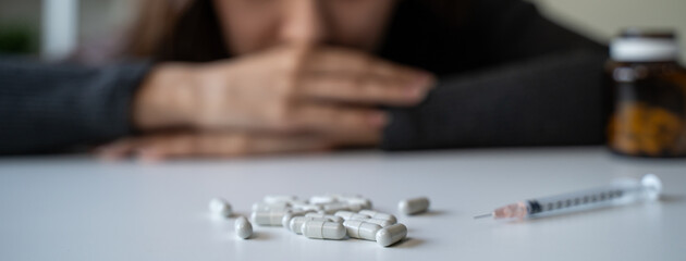 close up hand of young women. Stressed female taking drug overdose. - obrazy, fototapety, plakaty